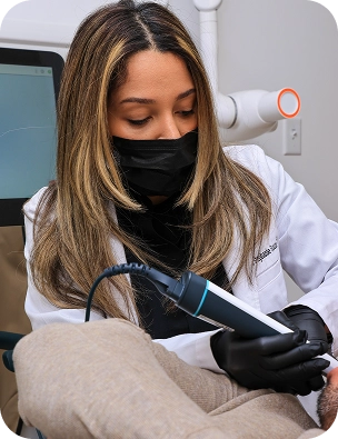 Dr. Stephanie using a digital intraoral scanner on a patient at Restore Dental in Peabody, MA