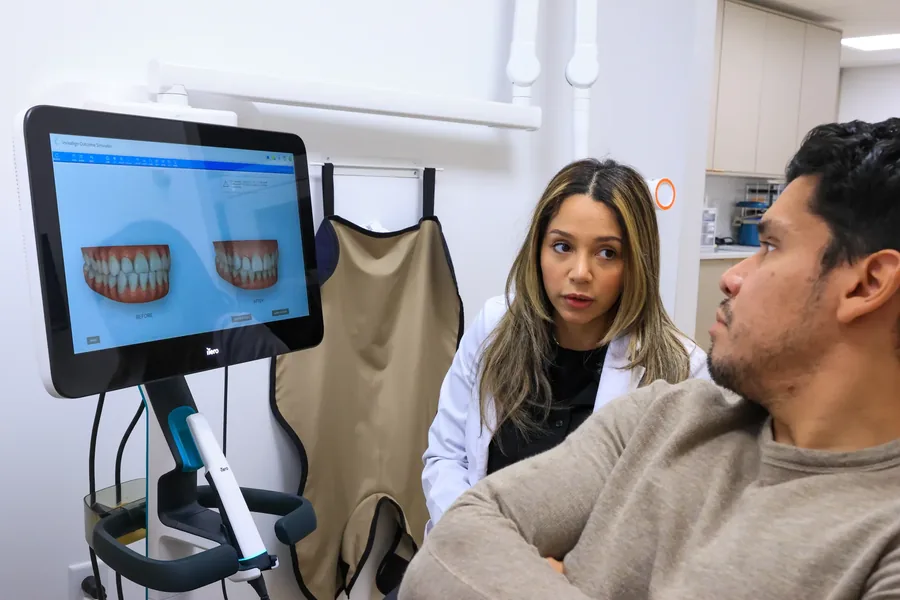 Before and after alignment simulation of a patient’s teeth shown on the chairside screen