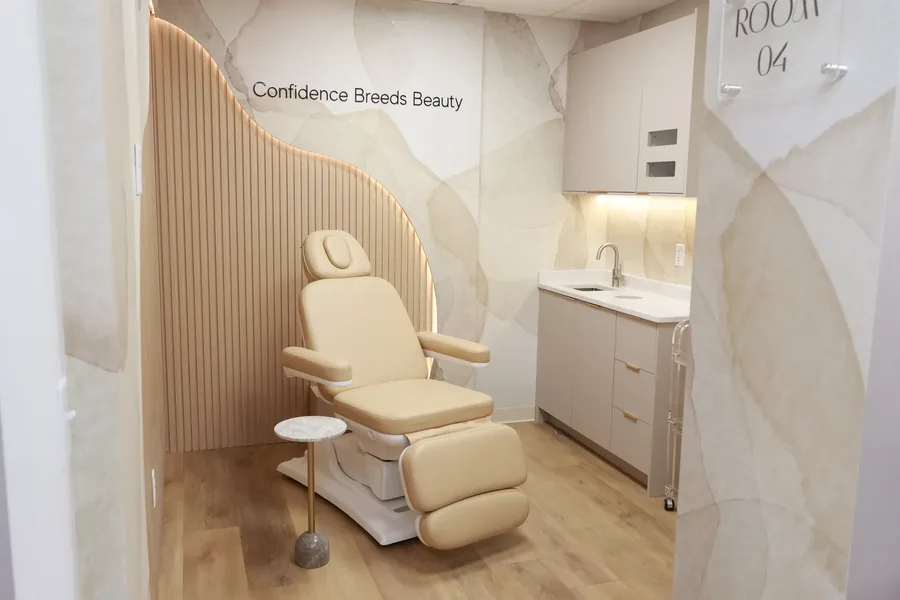 Dental spa room with wall lettering reading Confidence Breeds Beauty