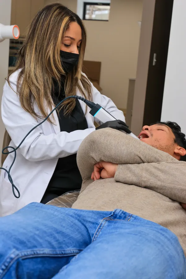 Dentist taking a digital intraoral scan of a patient instead of a putty impression